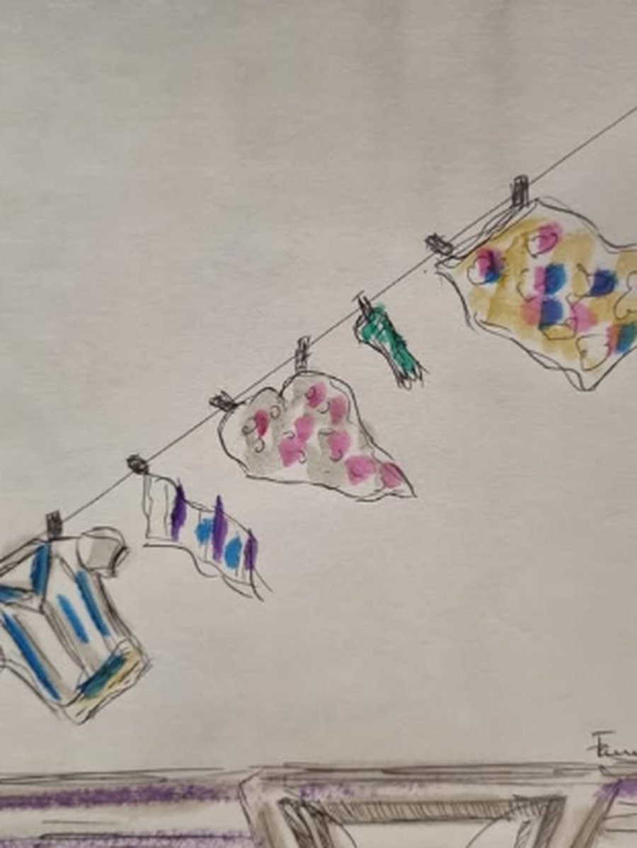 Dibujo de ropa colgada en un tendedero con colores vivos